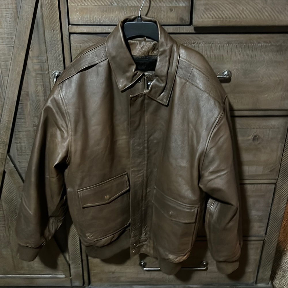 A brown leather jacket size 2xl